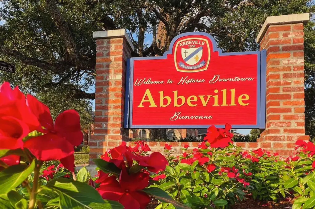 Welcome to Historic Downtown Abbeville, LA sign surrounded by flowers – Spedale's Florist