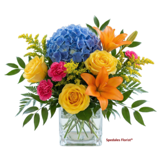 hermoine - Crystal clear glass cube arrangement designed with a bright and cheerful mix of hydrangea, roses, lilies, and miniature carnations