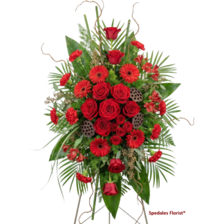 love and remebrance - This exquisite standing spray features premium red roses, gerbera daisies, alstroemeria, spray roses, and miniature carnation